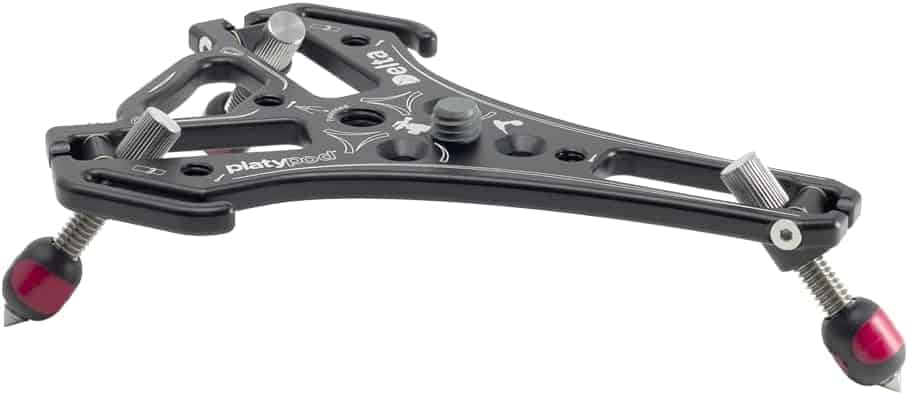 A rugged, low-profile camera support system for shooting in tight spaces or rough terrain, compatible with tripods and ball heads.